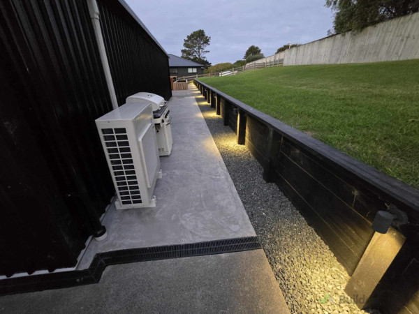 Additional concrete slab behind shed
