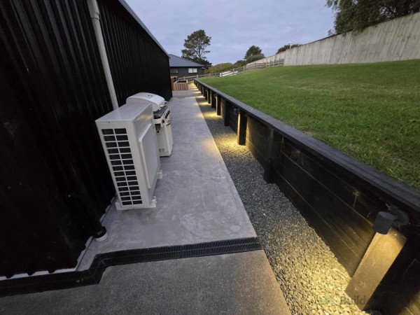 Additional concrete slab behind shed