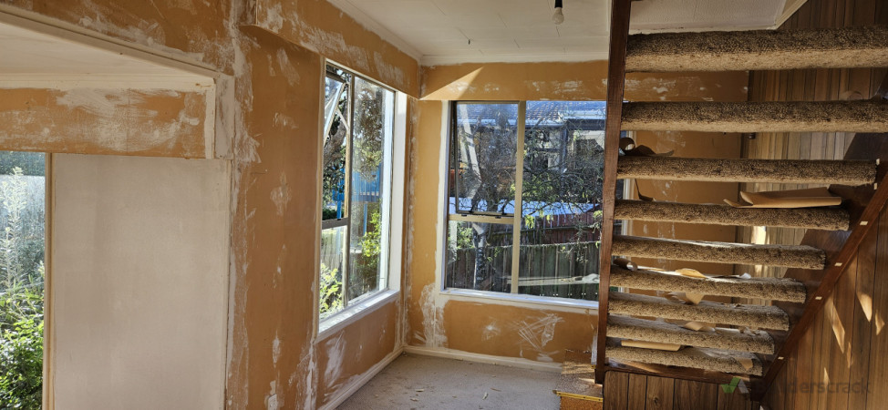 wallpaper removed and plastering under stair
