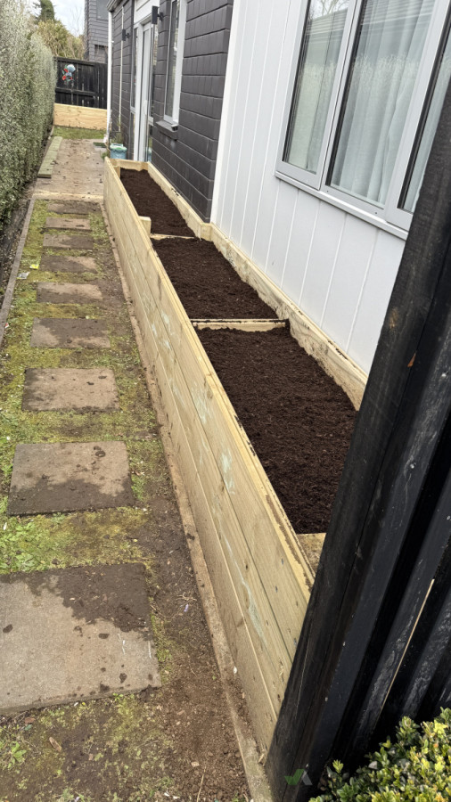 Carefully constructed planter box filled with quality soil for healthy plants