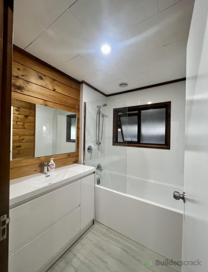 complete new bathroom including replacement of rotten floors, window, walls and new plumbing