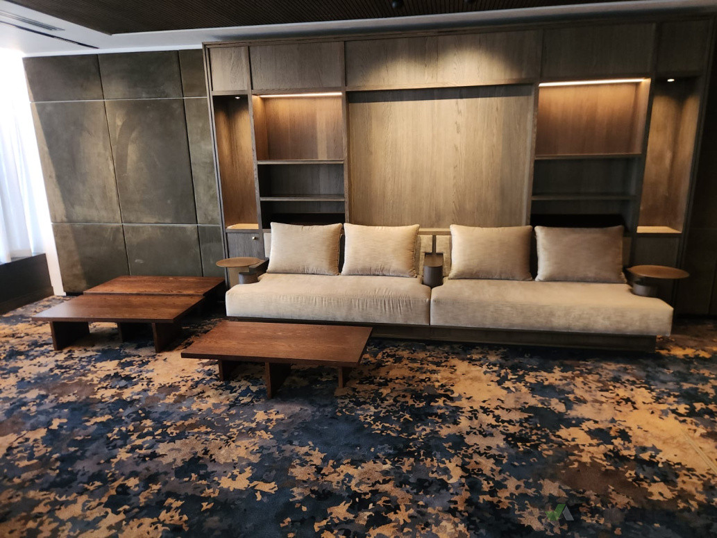 Woodgrain seating&suede panelling at concierge lounge[Woodland joinery]Silver interiors award nz