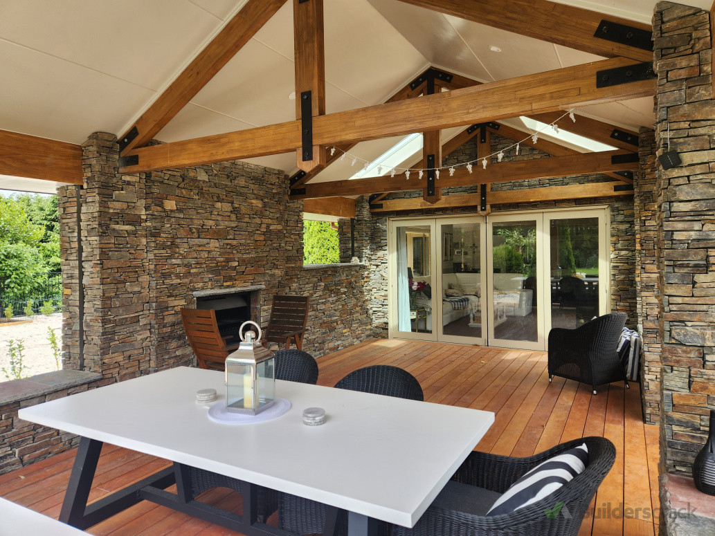 Inside the extension, open fireplace, exposed trusses, garapa decking