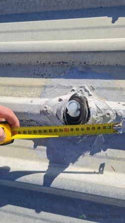 Old roof penetration sealed with silicone only – we installed a proper back flashing to ensure a long-term, watertight solution