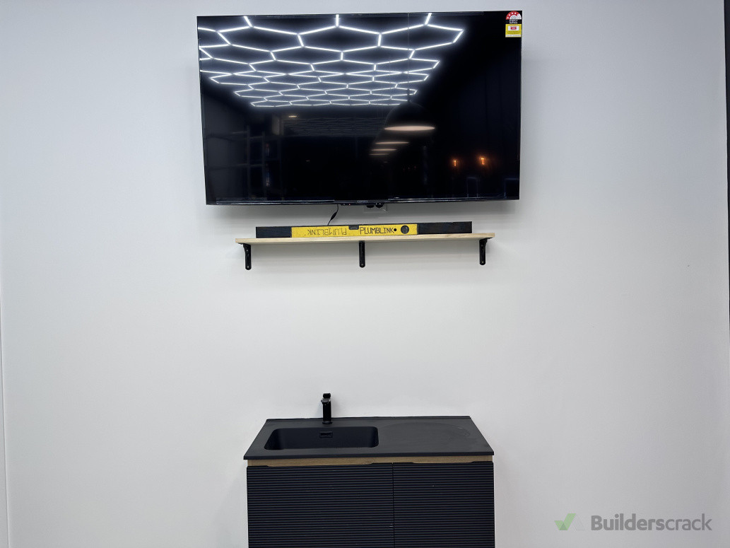 Monochrome done right ⚪⚫ Sleek black basin + crisp white walls = a barbershop with style.