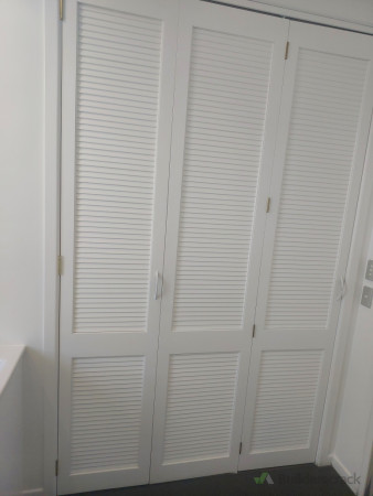 After renovation- doors painted, brass hinges installed