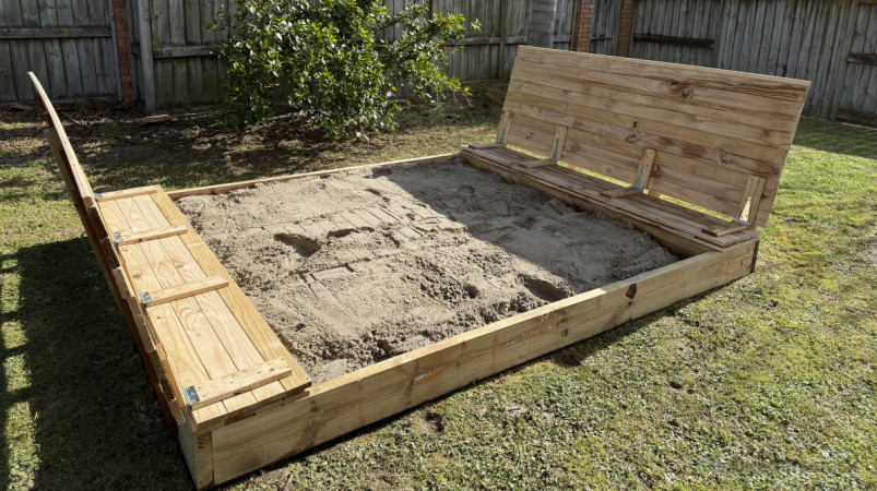 Front view of the finished sandpit, showing clean timber design and smooth child-safe edges.