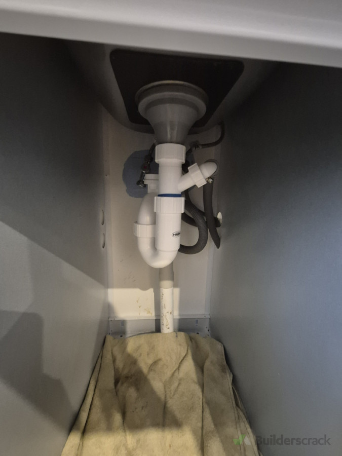 Install a double spigot trap for washing machine and dryer