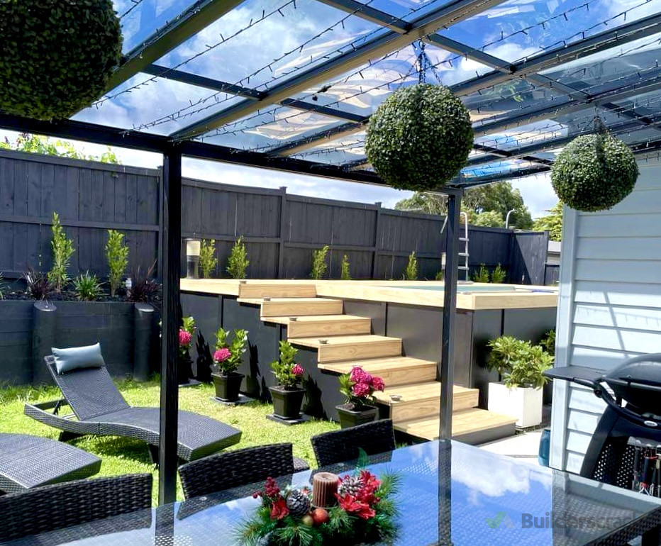 deck and stairs built around an above ground pool