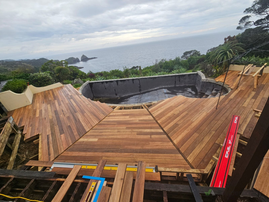 New decking being laid around pool.