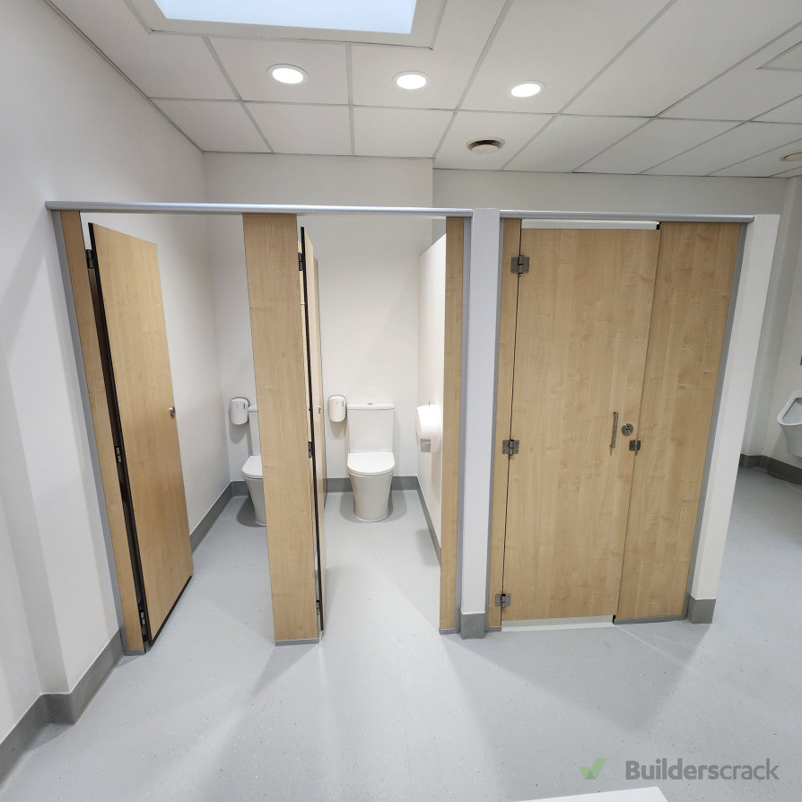 Construction of new commercial bathroom, including new toilets, shower, urinals, vanity units, and full partitioning system.