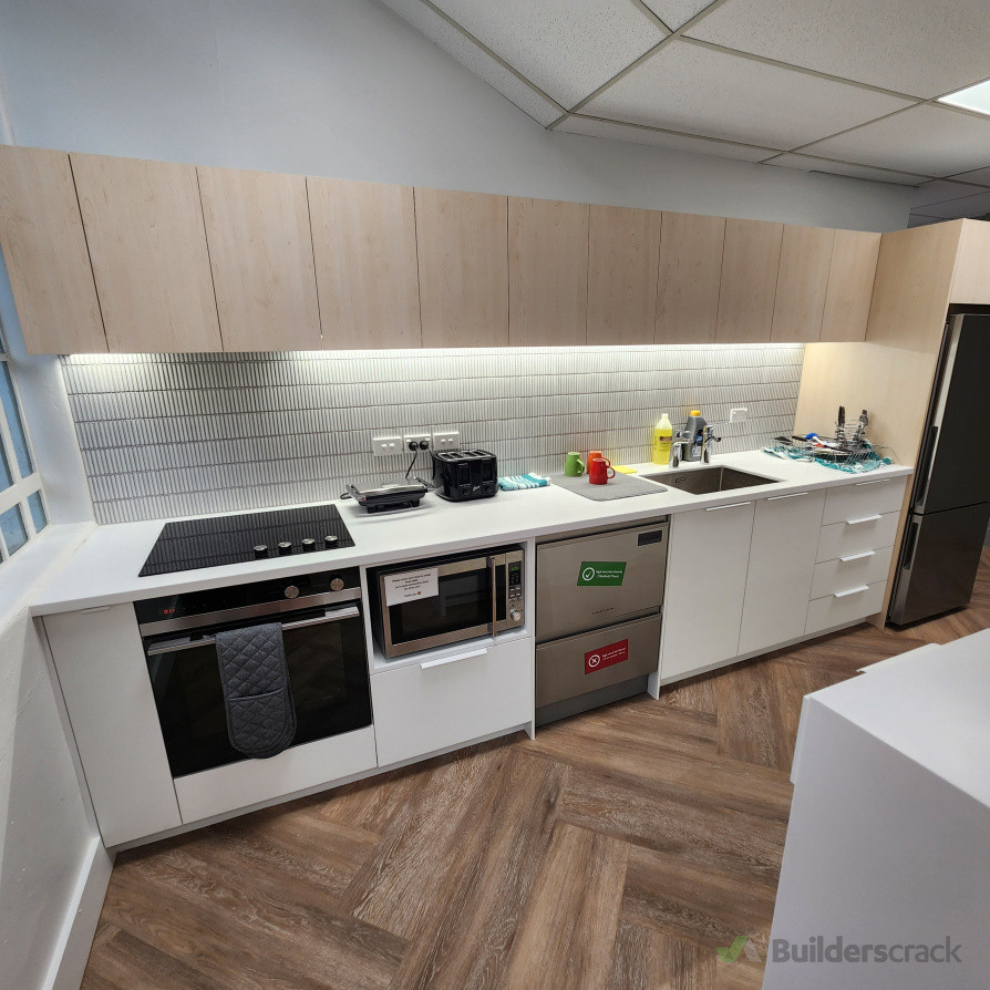 xisting kitchen units were removed, and wall surfaces were repaired and repainted. All plumbing and electrical work was carried out by registered tradespeople. A new kitchen, including a tiled backsplash and new appliances, has been fully installed.