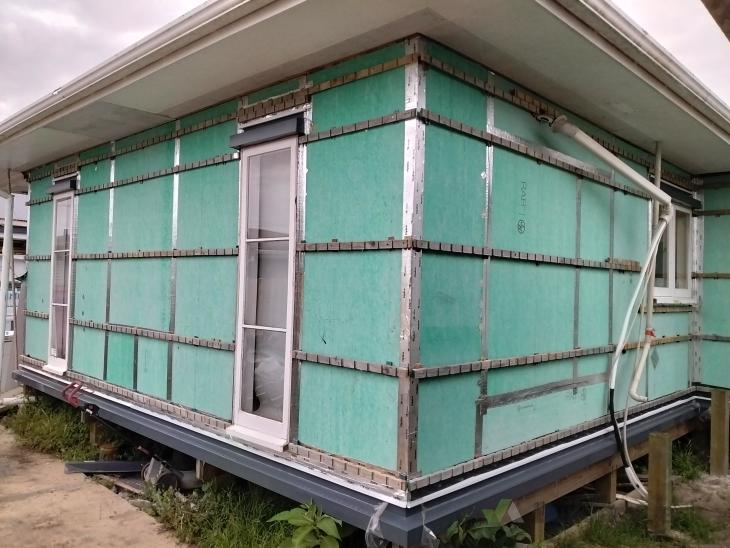 Relocated house to be re-clad in vertical long run iron (#1184330 ...