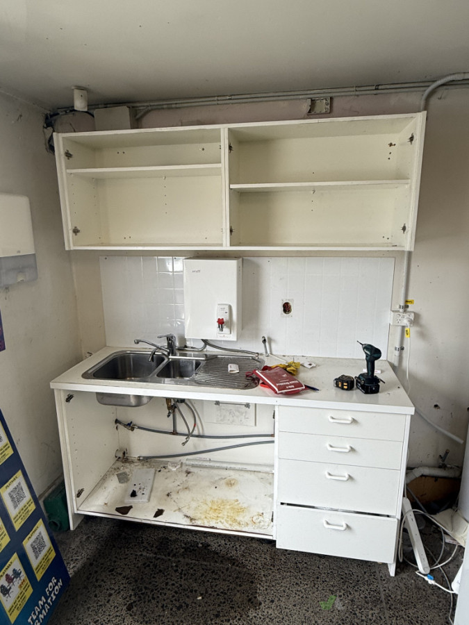 Remove old kitchen cabinets and fix water leak
