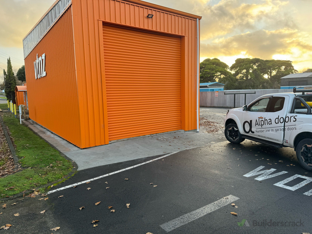 Roller Shutter door powdercoated in Orange with ECR600 auto opener
