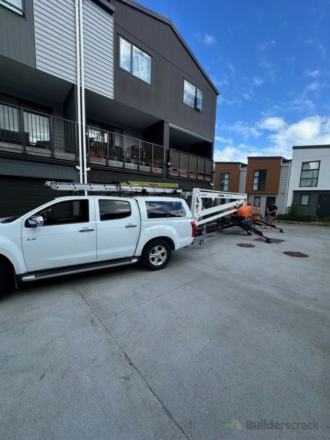 Using cherry picker to install heat pump on the 3rd floor of a unit