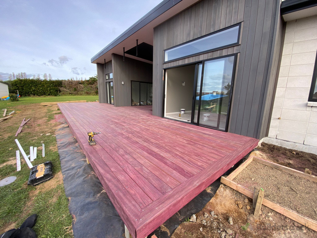 Stunning Purpleheart deck!! This exotic tropical hardwood delivers unbeatable durability, rot resistance, and that rich reddish-purple glow that'll patina beautifully over time.