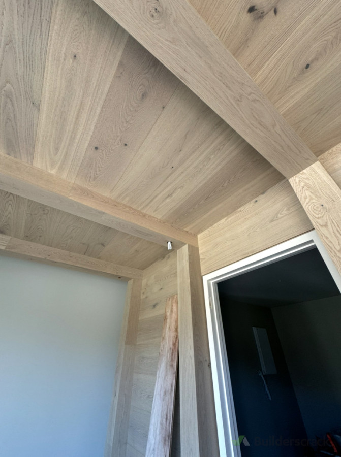Oak flooring wrapped around gym area and columns
