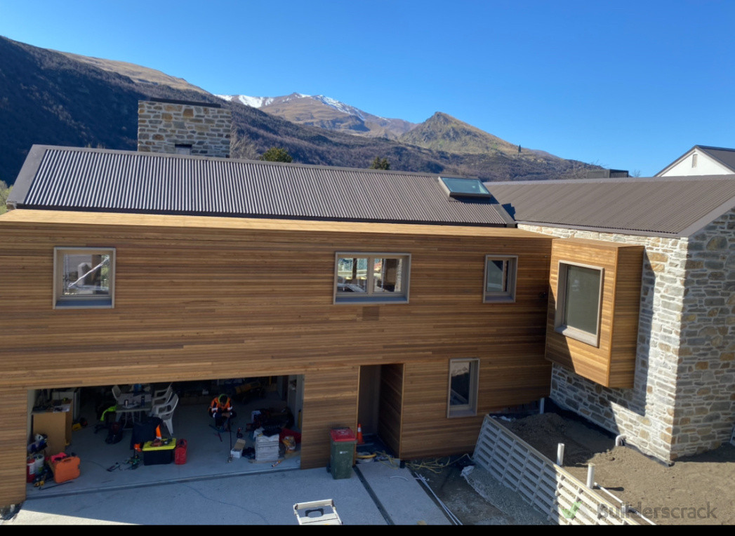 Small profile cedar cladding with hidden gutter details