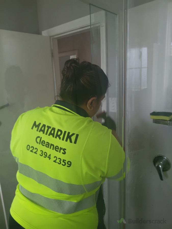 Nora removing build up on shower