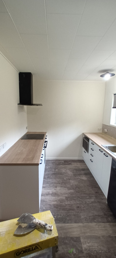 Kitchen repair. Owner had neighbor plaster the kitchen walls (back, left) wasn't happy, asked me to repair it