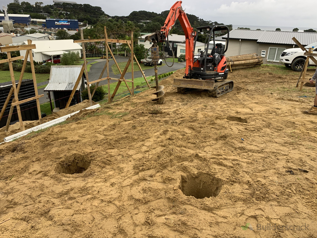 Drilling house piles site cuts