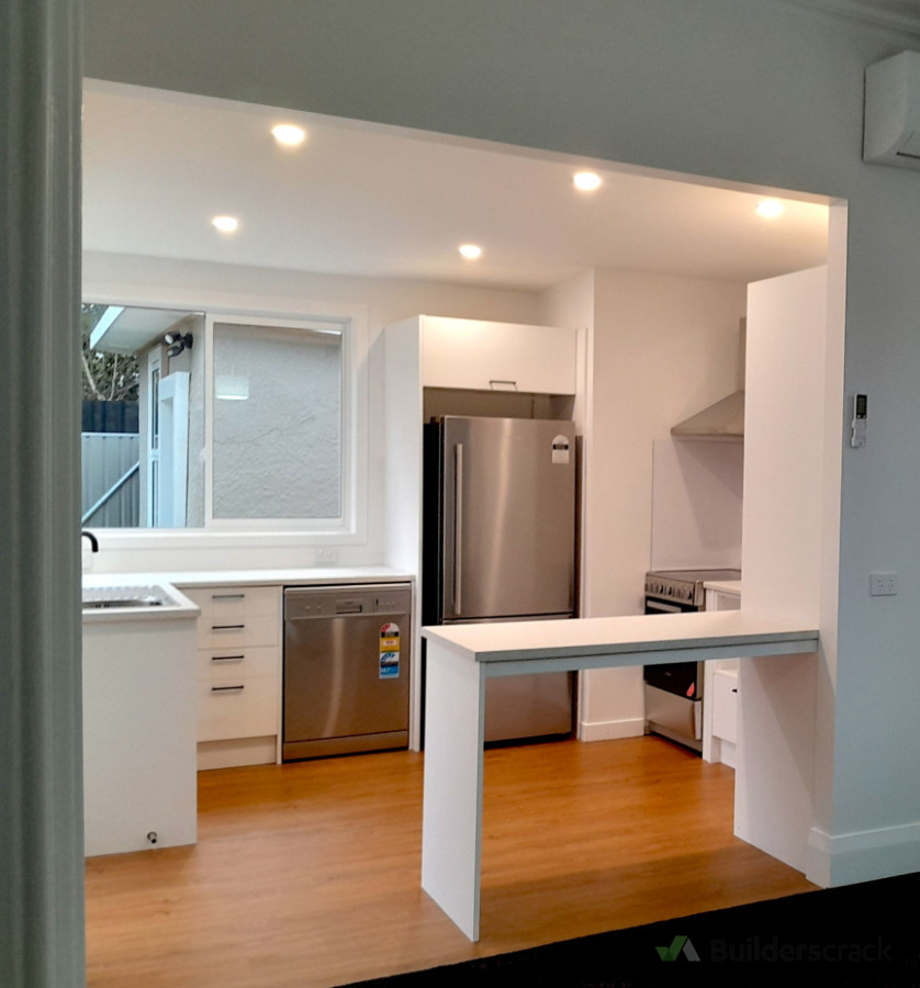 Removed wall to create open plan, added window, installed kitchen