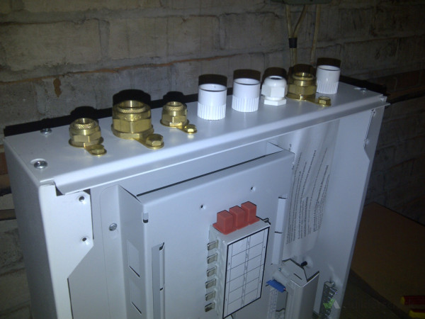 Preparing the new 3-phase switch board with glands and couplers for SWA cables and conduits.