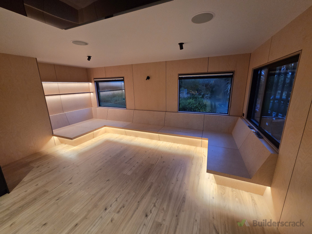 All lounge and kitchen area was done out of birch plywood with negative details including couch and dining chairs. Drop down tv from the ceiling and LED strip lights with hatch storage