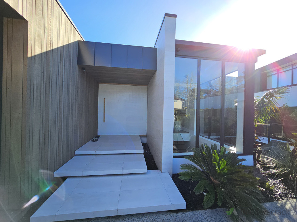 Entrance with floating tiles landings, cedar and euro tray cladding. New build we contracted to build