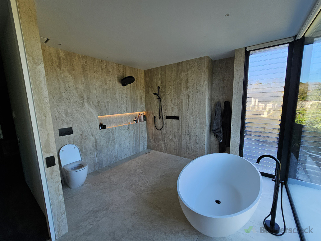 Full height tiles for ensuite bathroom we contracted to another company to do new build