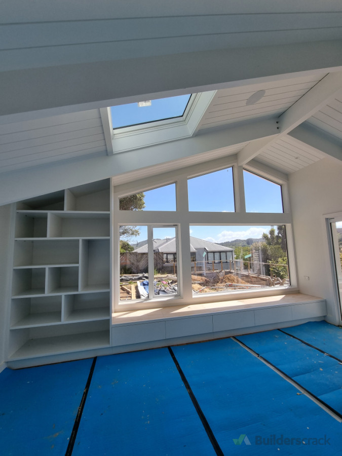Installation work, integrated bookshelf/ window seat