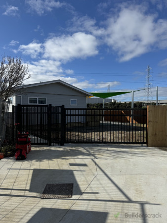 Manual sliding driveway gate and pedestrian gate installed, delivering secure and controlled access to the property.