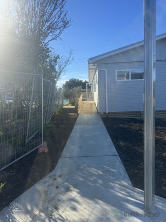 After: Newly installed concrete footpath with a durable broom finish for safety and traction.