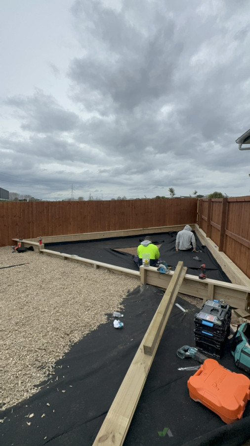 Our team constructing a custom-built sandpit for a pre-school, designed for safe and engaging play.