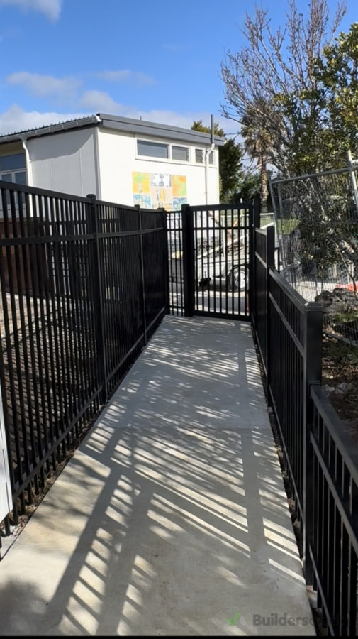 Custom gradient fencing installed to client specifications, transitioning from 1.8 m down to 1.2 m to align seamlessly with the ramp height.