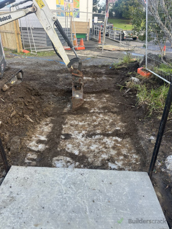 Before: Site prep in progress: Excavating the future concrete footpath.