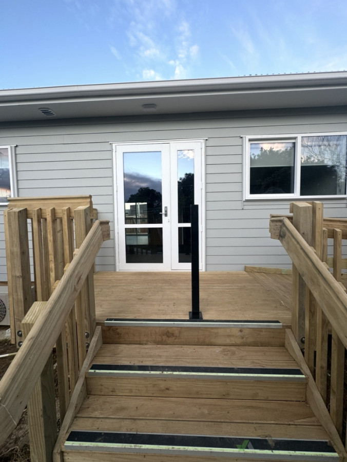 Before: Front stairway prior to the installation of a safety gate.