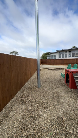 After: Timber fence with stain