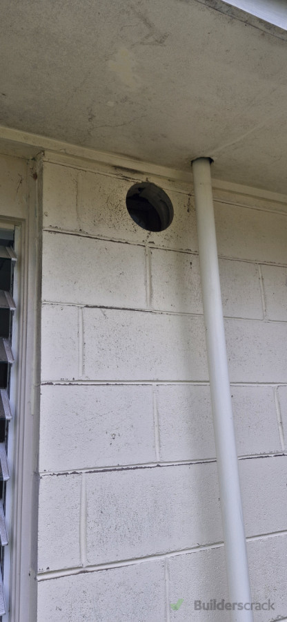 Hole drilled through block wall