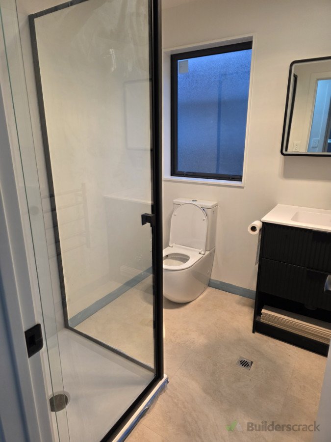 Floor tiles and fixtures completed, tile skirting to be installed next.