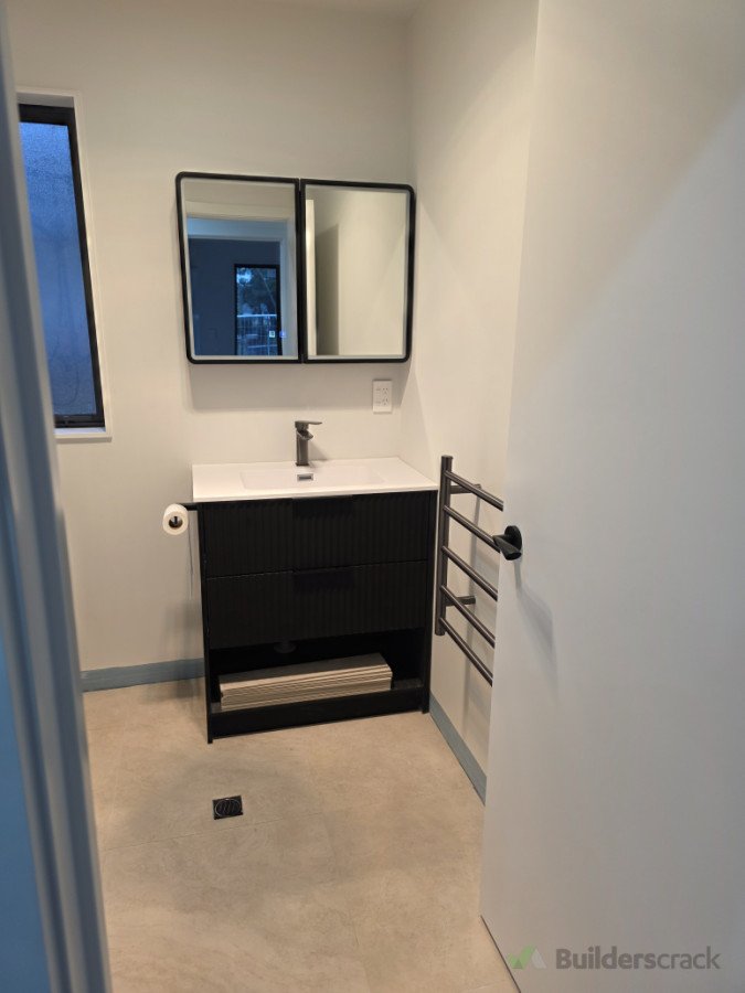 Floor tiles and fixtures completed, tile skirting to be installed next.