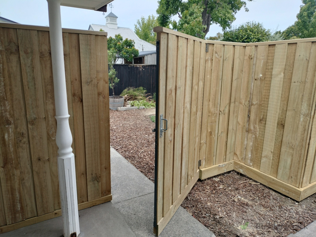 Timber gate on steel frame with latch