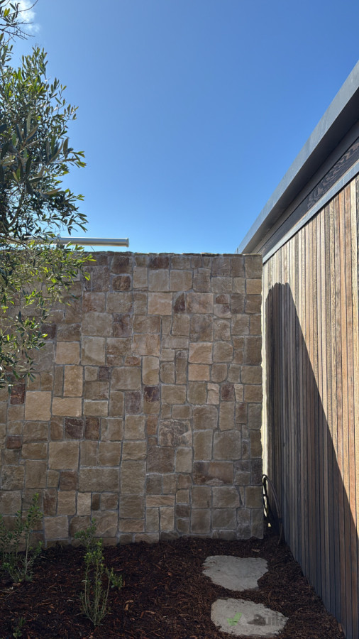 Te Arai, stone cladding outdoor fire place