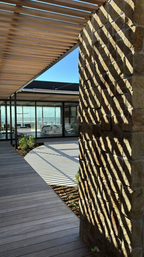 Te Arai, stone cladding outdoor fire place