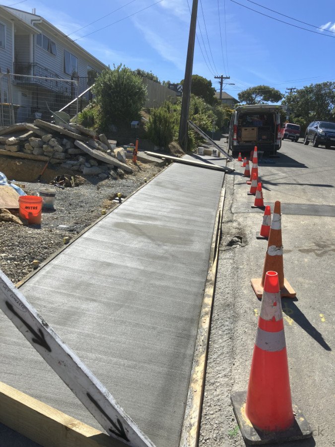 Kerb crossing poured with new services and storm water running underneath.