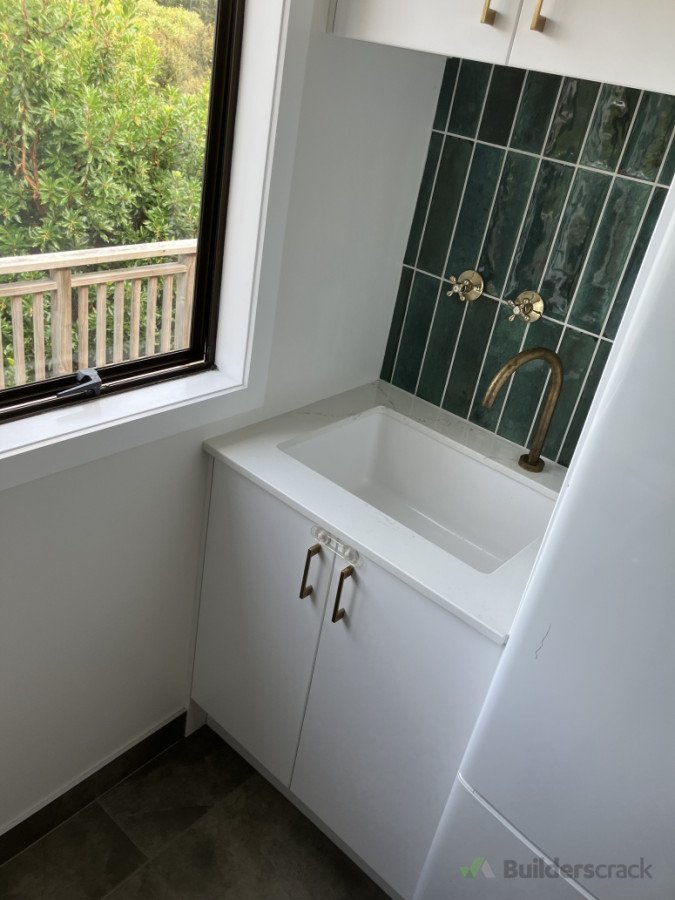 The wall mounted brass taps are a cool feature.