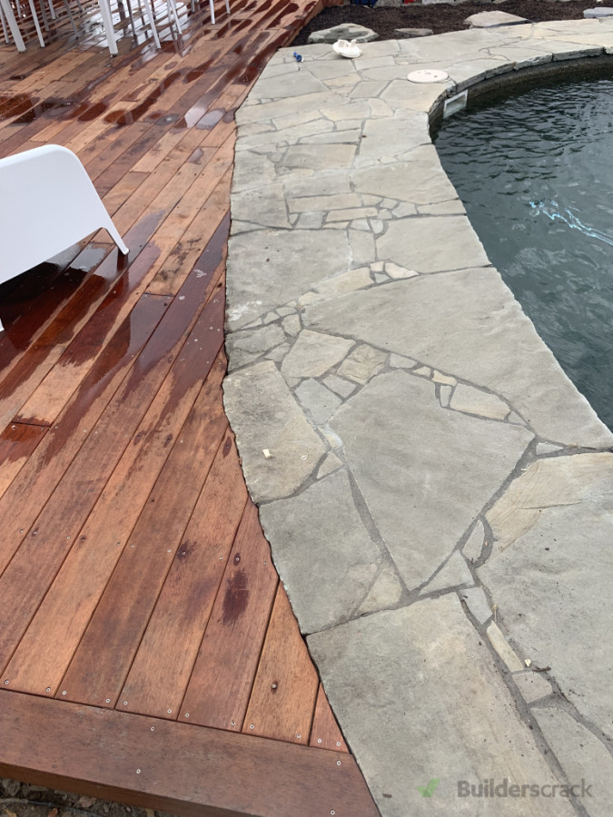 Deck checkout around paving around pool