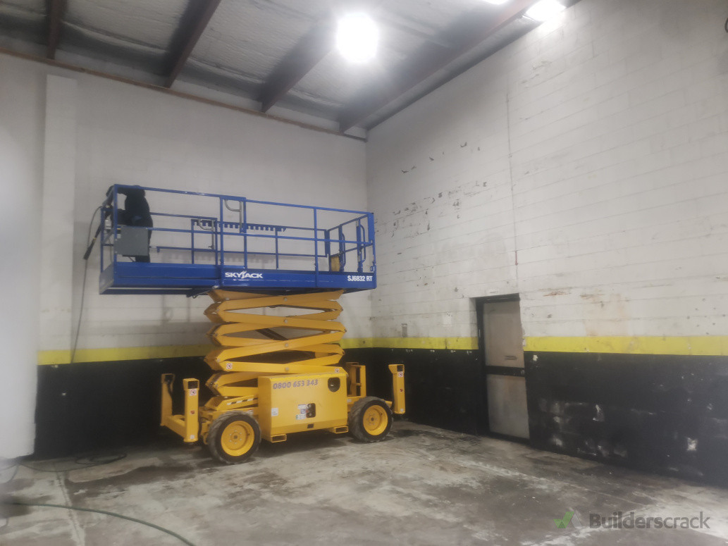 Walls getting washed before painting