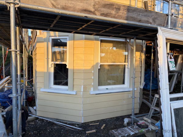 Cladding on, joinery in